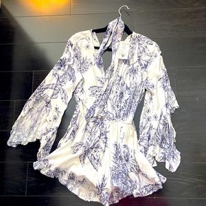 Short jumpsuit feminine outfit.